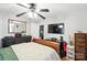 Bedroom featuring hard wood floors, a ceiling fan, and view into kitchen at 407 Rosemont Ave, Kannapolis, NC 28081