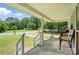 View from covered porch with chairs, greenery, and a view of the street at 407 Rosemont Ave, Kannapolis, NC 28081