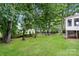 Lush backyard with mature trees and well-maintained lawn at 4308 Pinto Ln, Gastonia, NC 28052