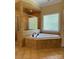 Luxurious bathroom featuring a soaking tub and separate tiled shower with glass door at 6184 Chandler Rd, Clover, SC 29710