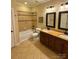 Bathroom featuring double vanity sinks with beautiful countertops and tile flooring at 6184 Chandler Rd, Clover, SC 29710