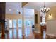 Spacious living room with hardwood floors, large windows, and access to an outdoor deck at 6184 Chandler Rd, Clover, SC 29710