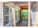 View of a screened-in porch featuring wood flooring and ceiling with an opening into the deck area at 6184 Chandler Rd, Clover, SC 29710