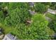An aerial view of the neighborhood showcases lush, mature trees and homes at 6706 Farrington Ln, Charlotte, NC 28227