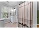 Bathroom featuring a vanity, mirror, shower with curtain and a window at 6706 Farrington Ln, Charlotte, NC 28227