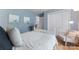 Bedroom features a modern design with a bed, chair, and neutral décor at 6706 Farrington Ln, Charlotte, NC 28227