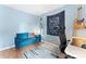 Bedroom featuring a blue accent wall, modern desk, and natural light at 6706 Farrington Ln, Charlotte, NC 28227
