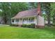 Cozy home with a well-kept lawn and a charming front porch at 6706 Farrington Ln, Charlotte, NC 28227