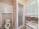 Powder room with a white vessel sink, neutral countertop, and walk-in shower at 729 Montgomery Ave, Albemarle, NC 28001