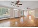 Spacious living room with hardwood floors, ceiling fans, and windows that provide plenty of natural light at 729 Montgomery Ave, Albemarle, NC 28001