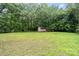 The backyard has a grassy area and a shed at 7613 Happy Hollow Dr, Mint Hill, NC 28227