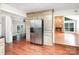 Updated kitchen with stainless steel appliances, custom cabinets, and a view to the living room at 7613 Happy Hollow Dr, Mint Hill, NC 28227