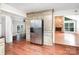 Updated kitchen with stainless steel appliances, custom cabinets, and a view to the living room at 7613 Happy Hollow Dr, Mint Hill, NC 28227