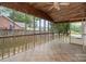 Relaxing screened porch with tiled floors, ceiling fan, and views of the backyard at 7613 Happy Hollow Dr, Mint Hill, NC 28227