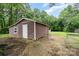The large shed is perfect for storage or a workshop at 7613 Happy Hollow Dr, Mint Hill, NC 28227