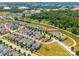 An overhead view of a residential area highlighting the arrangement of homes and streets within a green, tree-lined setting at 827 Digby Rd, Rock Hill, SC 29730