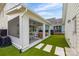 Private backyard features artificial turf lawn and a screened in porch with outdoor seating at 827 Digby Rd, Rock Hill, SC 29730
