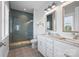 Bathroom with a tile shower, double sink vanity, and patterned tile flooring at 827 Digby Rd, Rock Hill, SC 29730