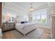 Bright bedroom with tray ceilings, chandelier, and large windows offering natural light at 827 Digby Rd, Rock Hill, SC 29730