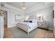 Bright bedroom with tray ceilings, chandelier, and large windows offering natural light at 827 Digby Rd, Rock Hill, SC 29730