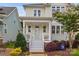 Inviting home exterior featuring a light blue front door, covered porch, and attractive landscaping at 827 Digby Rd, Rock Hill, SC 29730