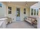 Cozy covered front porch with stylish decor, including lanterns, seating, and a welcoming ambiance at 827 Digby Rd, Rock Hill, SC 29730