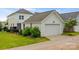 Detached two-car garage with green lawn and a fenced in yard for outdoor enjoyment at 827 Digby Rd, Rock Hill, SC 29730