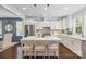 Open kitchen featuring a large island, stainless appliances, and sleek white cabinetry at 827 Digby Rd, Rock Hill, SC 29730
