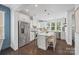 Bright kitchen boasts white cabinetry, stainless steel appliances, and a center island with seating at 827 Digby Rd, Rock Hill, SC 29730