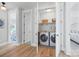 Convenient laundry room closet with modern washer and dryer and built-in storage at 827 Digby Rd, Rock Hill, SC 29730