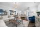 Open-concept living space with modern furnishings, hardwood floors, and seamless flow to the dining area and kitchen at 827 Digby Rd, Rock Hill, SC 29730