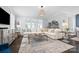 Comfortable living room showcasing a large sectional, hardwood floors, and abundant natural light at 827 Digby Rd, Rock Hill, SC 29730