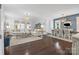 Spacious open-concept living room with hardwood floors, a large sectional sofa, and ample natural light at 827 Digby Rd, Rock Hill, SC 29730