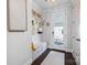 Functional mudroom features wainscoting, a built-in bench, and convenient storage options at 827 Digby Rd, Rock Hill, SC 29730