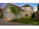 Rear view of home highlighting the detached garage, screened porch and fenced-in yard at 827 Digby Rd, Rock Hill, SC 29730