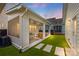 Backyard view of home showcasing the screened porch, patio and green grass at 827 Digby Rd, Rock Hill, SC 29730