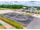 Aerial view of bike park with smooth asphalt track, framed by trees and a modern building at 827 Digby Rd, Rock Hill, SC 29730