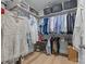 Organized walk-in closet with shelving and hanging storage for clothes and accessories at 827 Digby Rd, Rock Hill, SC 29730