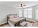 Comfortable bedroom featuring a metal bed frame, soft lighting, and a decorative bench at 1032 Spyglass Ln, Waxhaw, NC 28173