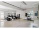 Spacious garage with epoxy floors, a golf cart, and storage shelves for tools and equipment at 1032 Spyglass Ln, Waxhaw, NC 28173