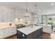 Beautiful kitchen with an island, custom cabinets, stainless steel appliances and a modern design at 1032 Spyglass Ln, Waxhaw, NC 28173