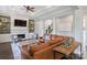 Cozy living room with a fireplace, built-in bookshelves, and open floor plan at 1032 Spyglass Ln, Waxhaw, NC 28173