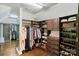 Spacious walk-in closet with custom shelving, drawers, and ample storage for clothes and shoes at 1032 Spyglass Ln, Waxhaw, NC 28173