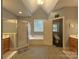 Bright bathroom features a separate shower, soaking tub, and double vanities, creating a spa-like retreat at 11646 Hidden Forest Ln, Davidson, NC 28036