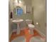 Charming powder room features a pedestal sink, toilet, and painted walls at 11646 Hidden Forest Ln, Davidson, NC 28036