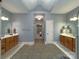 Spacious bathroom with double vanities and modern fixtures, offering a luxurious and functional space at 11646 Hidden Forest Ln, Davidson, NC 28036