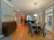 Open concept dining area flows into the kitchen and living room at 11646 Hidden Forest Ln, Davidson, NC 28036