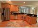 Well-equipped kitchen featuring stainless steel appliances, granite countertops, and custom cabinetry at 11646 Hidden Forest Ln, Davidson, NC 28036