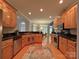 Open-concept kitchen with stainless steel appliances and views of the breakfast area at 11646 Hidden Forest Ln, Davidson, NC 28036