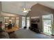 Bright living room features vaulted ceilings, large windows, and open floor plan at 11646 Hidden Forest Ln, Davidson, NC 28036